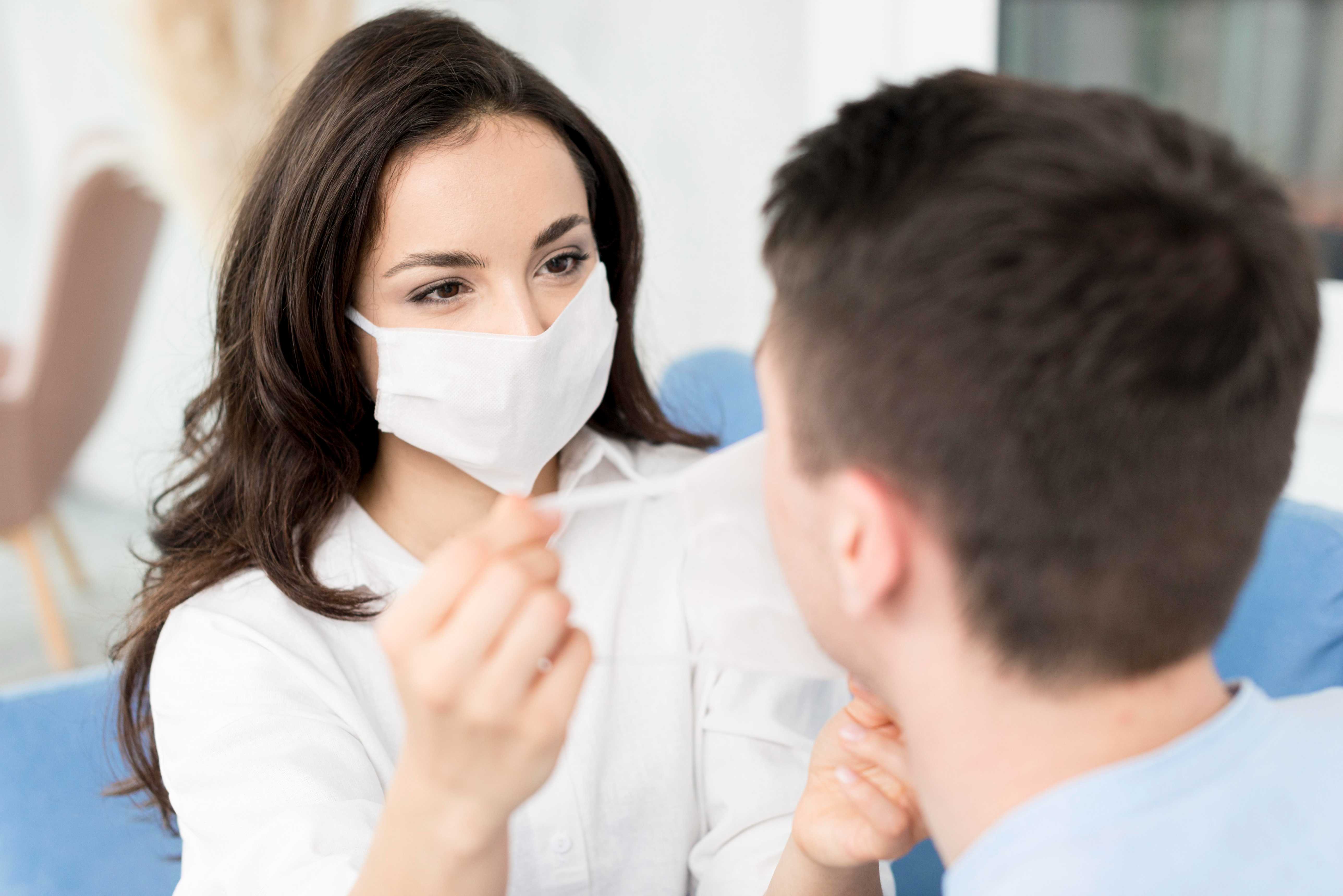 Patient smiling after bad breath treatment